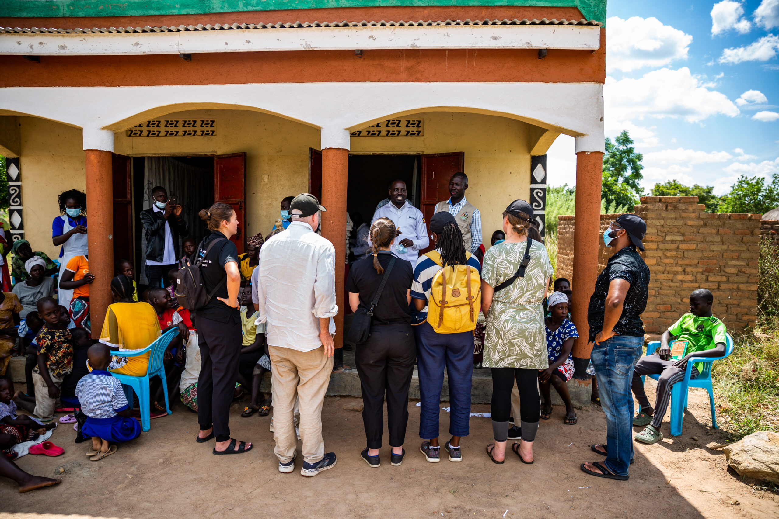 Amref USA staff learning about the clinic! Here you can see the two rooms in full view! Photo Credit: Ambrose Watanda.